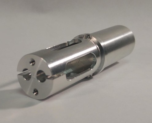Swiss Turning by IML-Fiber Optic Component #1: Made completely in one operation Uses multiple live axial and radial tooling as well as internal broaching